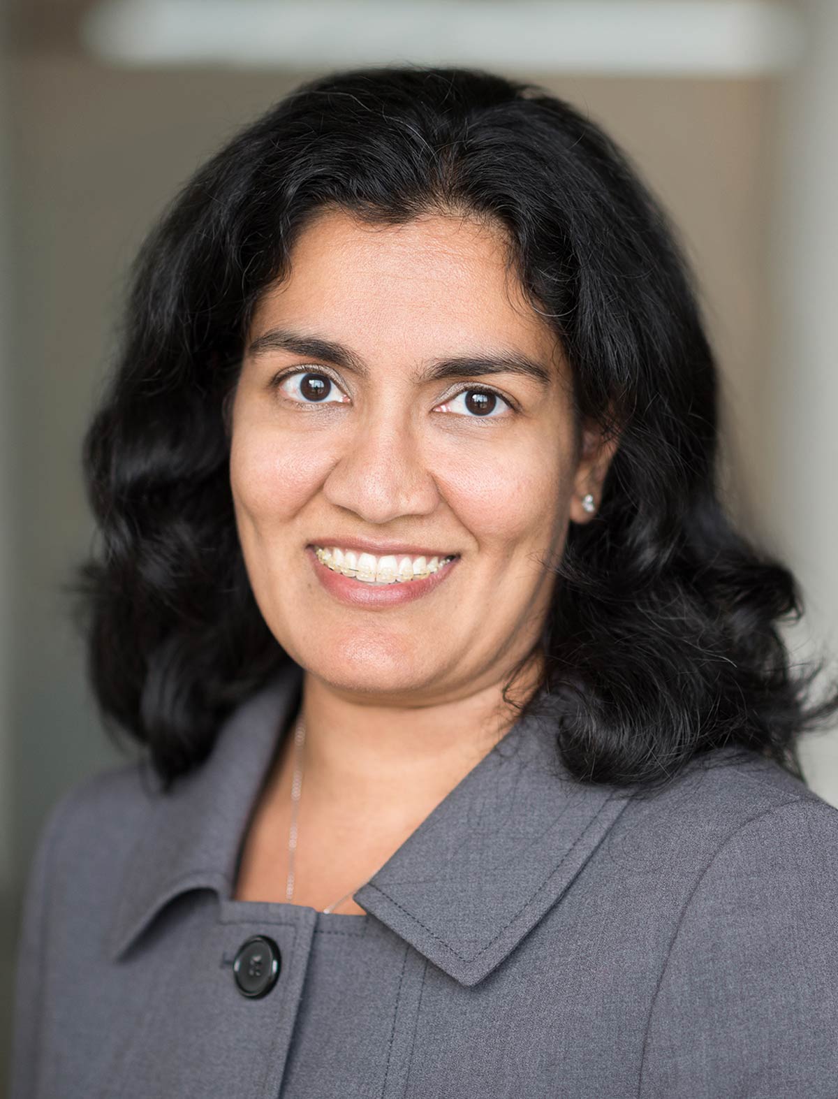 Sheila Swaroop smiling in a professional photo