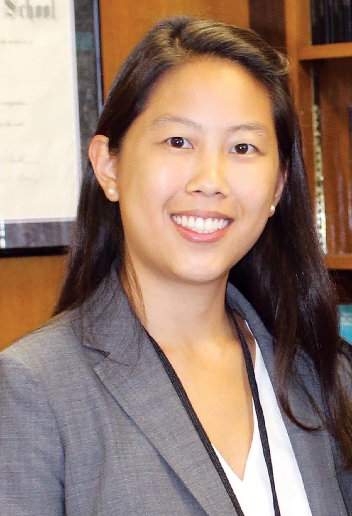 Margaret Chen ’12 smiling while wearing a grey suit jacket