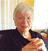 Judge E. Patricia Herron ’64 sitting and smiling