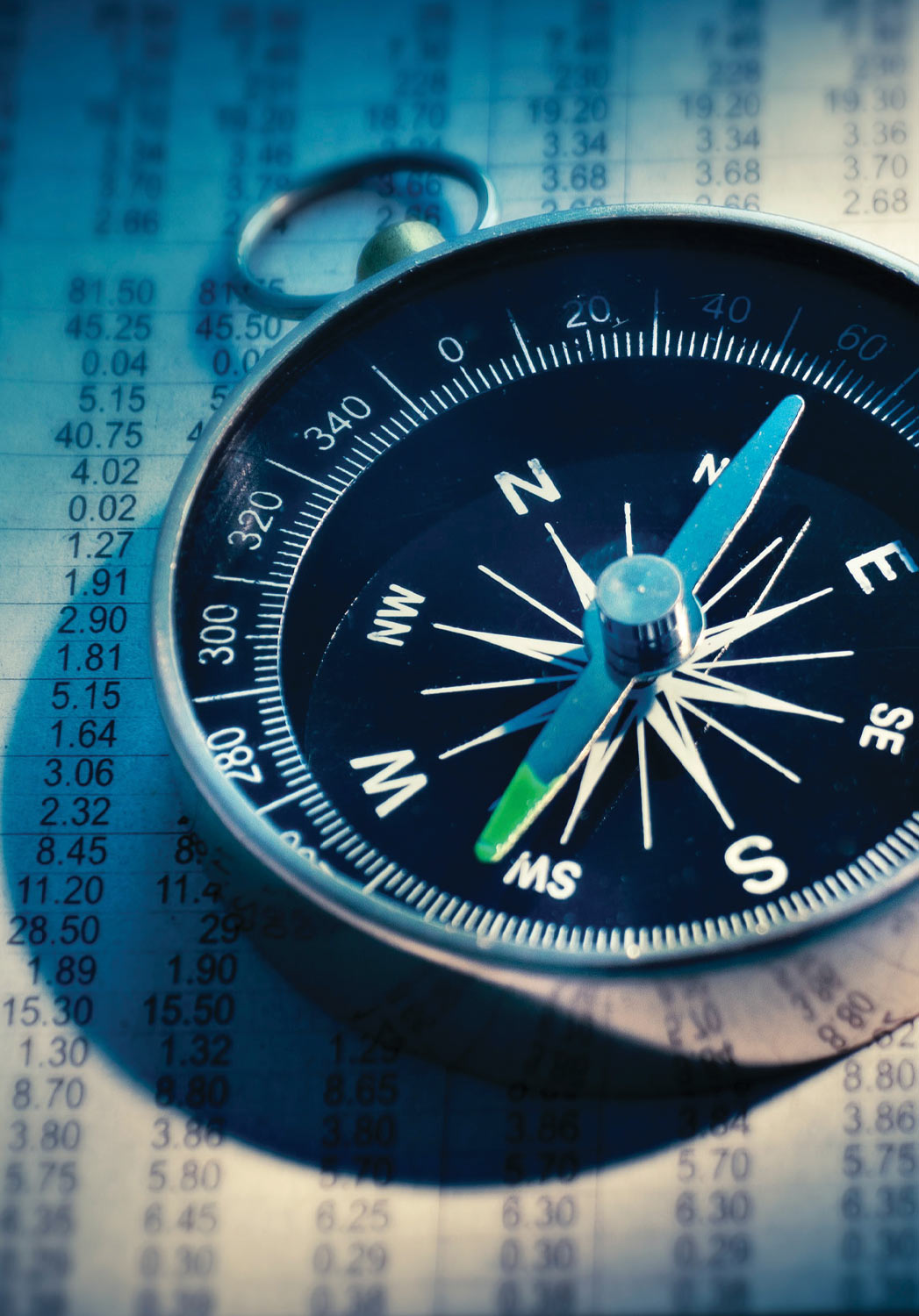 close up of a compass on data paperwork