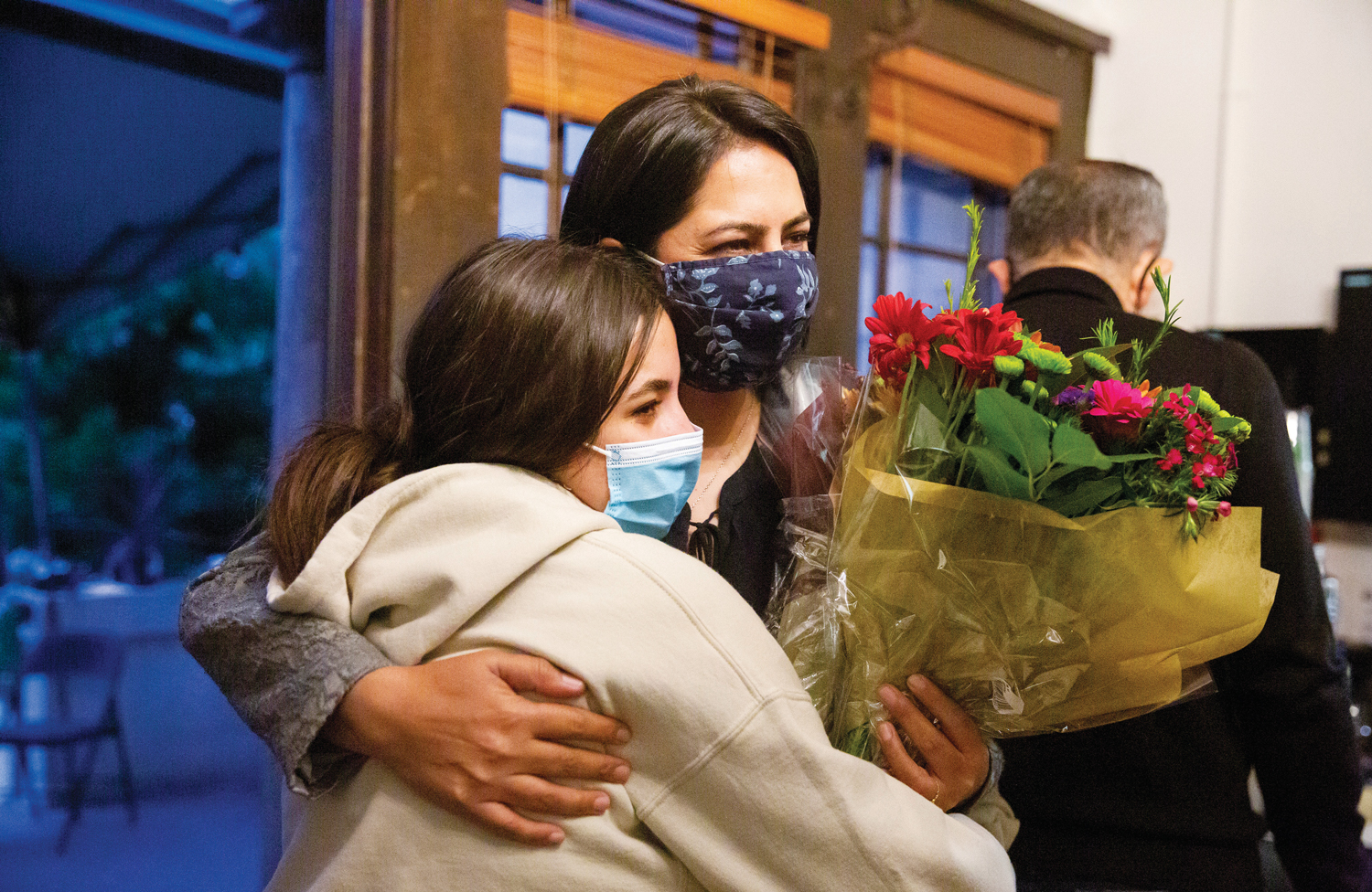 The safe arrival of Afghan scholar Khwaga Ghani (right) in Berkeley is  welcomed by a relative.
