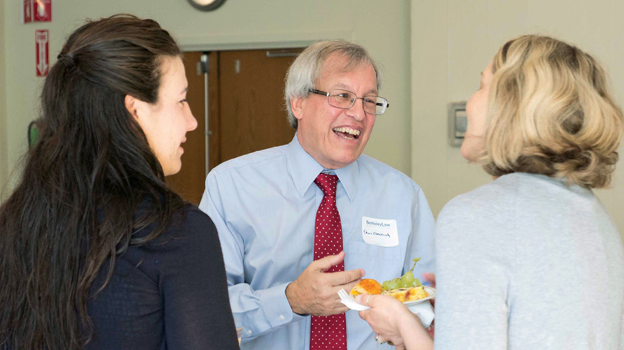 Berkeley Law community members chat with Chemerinsky at his welcome breakfast in 2017