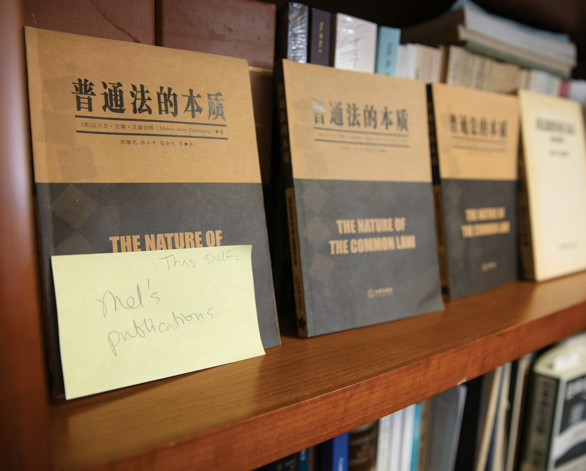 Mel's publications written on post-it note on books
