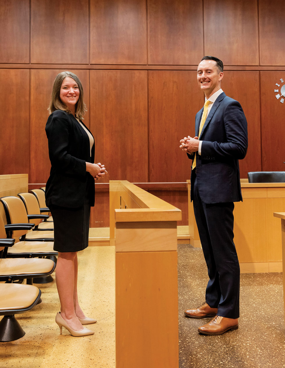 Natalie Winters and Spencer Pahlke in a courtroom