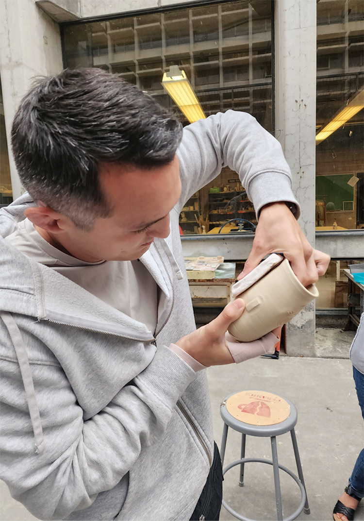 Mark Mabry sculpting a mug