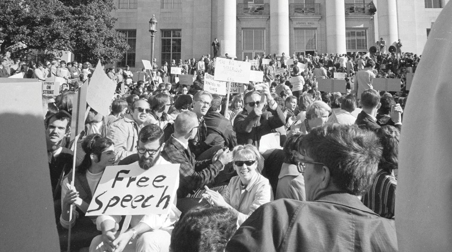 black and white photo of student protesters packing Sproul Plaza for a free speech rally in 1964