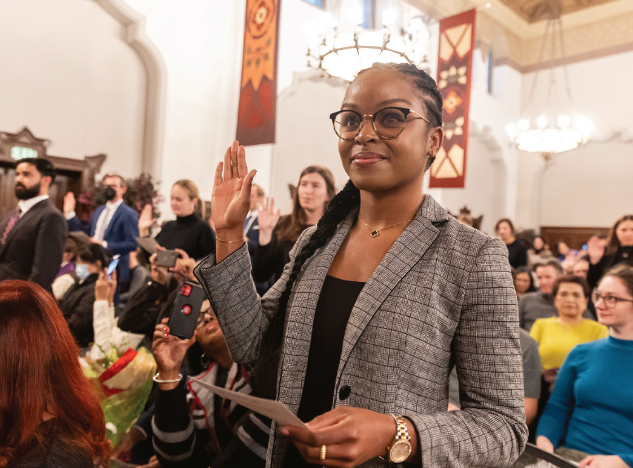 Rudi-Ann Miller with her hand raised while taking oath