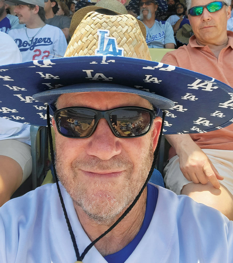 Glenn Gottlieb wearing sunglasses and a straw hat