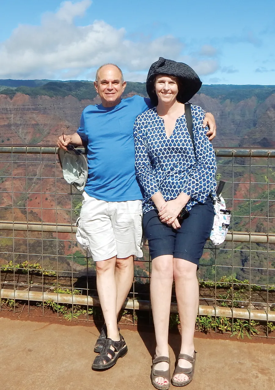 Carol Brownstein and Professor David Lieberman posing together with the landscape in the background